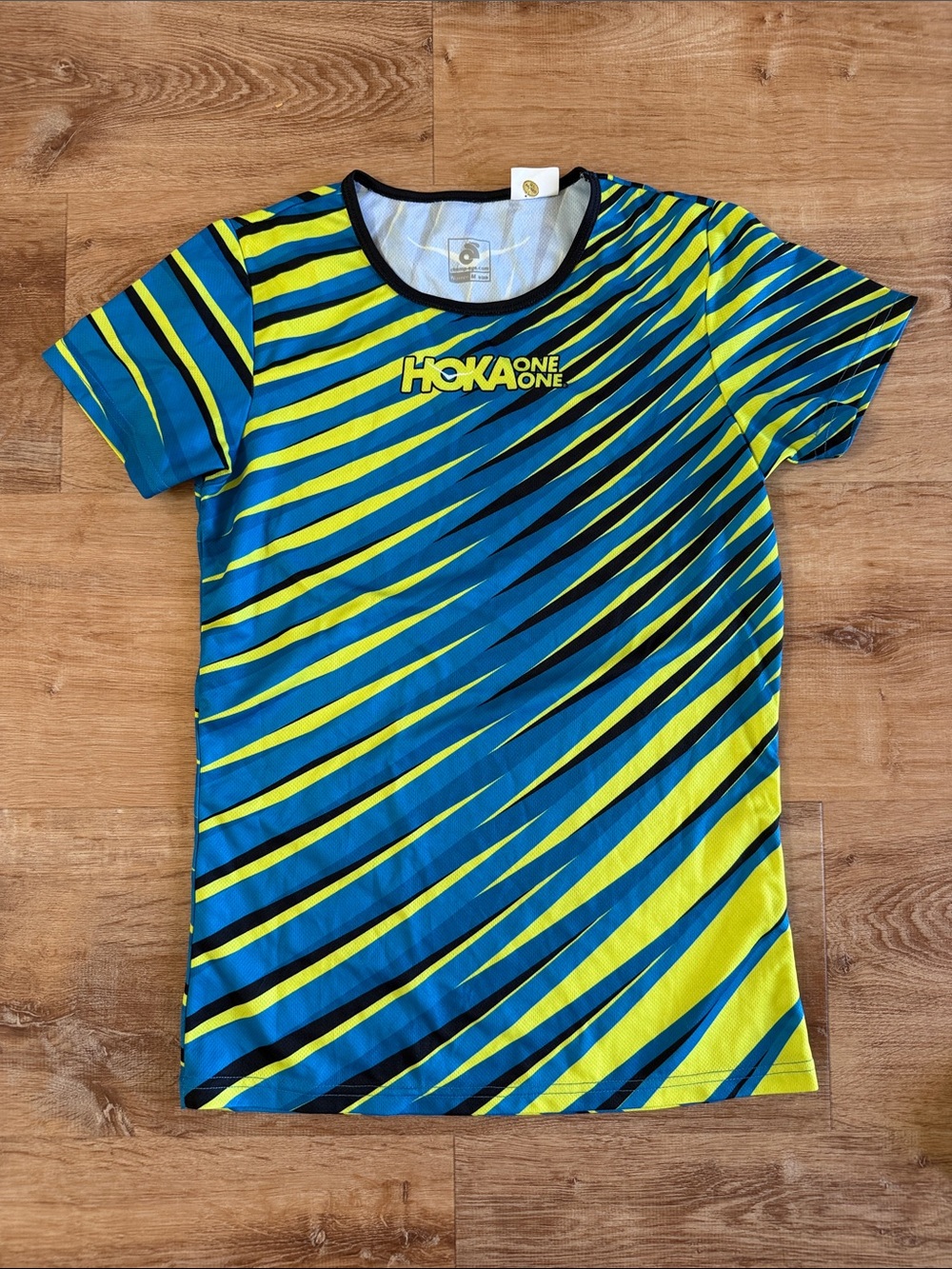 Hoka One One Women’s Black Jacket with Blue & Yellow Striped Top - Picture 3 of 5